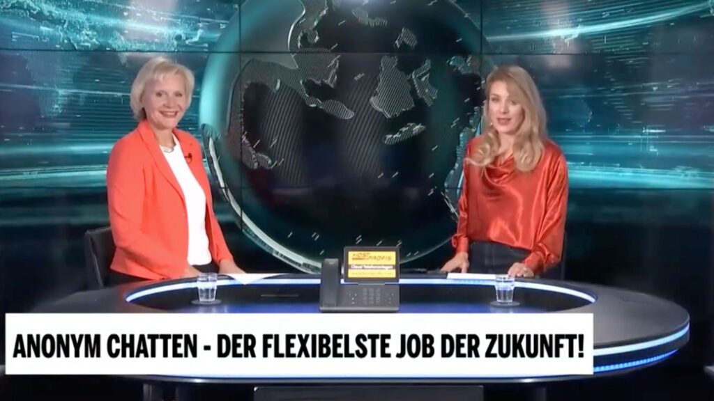 Ulli Lang und die Moderatorin Tatjana sitzen im OE24 Studio in Wien nebeneinander und führen ein Interview